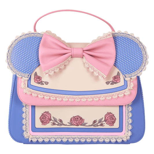 Minnie Mouse crossbody bag with pink bow, floral designs, and polka dot accents on a white background