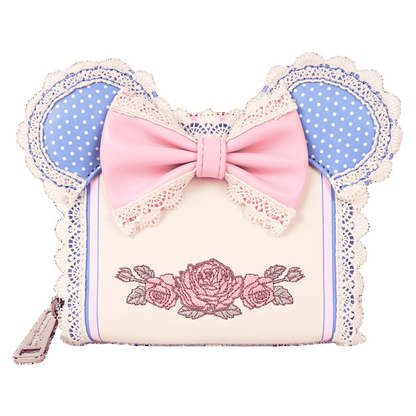 Wallet with pink bow and floral design on a white background