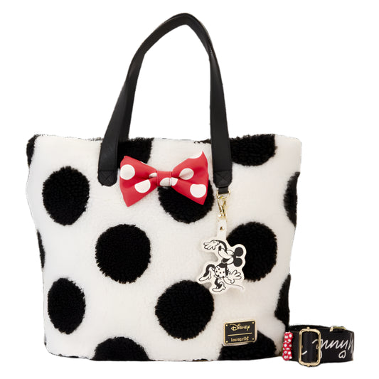Black and white polka dot handbag with a red bow and Disney Minnie Mouse charm on a white background