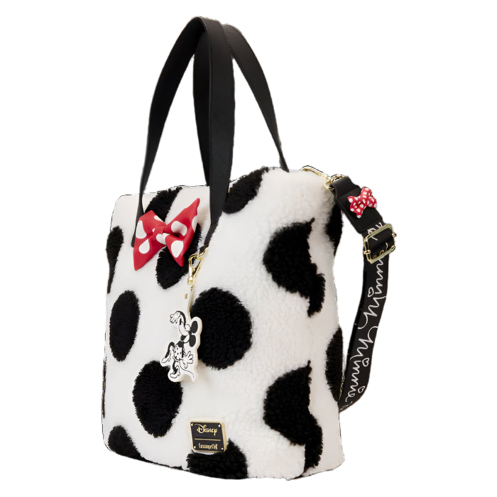 Sherpa fuzzy tote with black and white polka dot pattern, red bow, and Disney charm on a white background