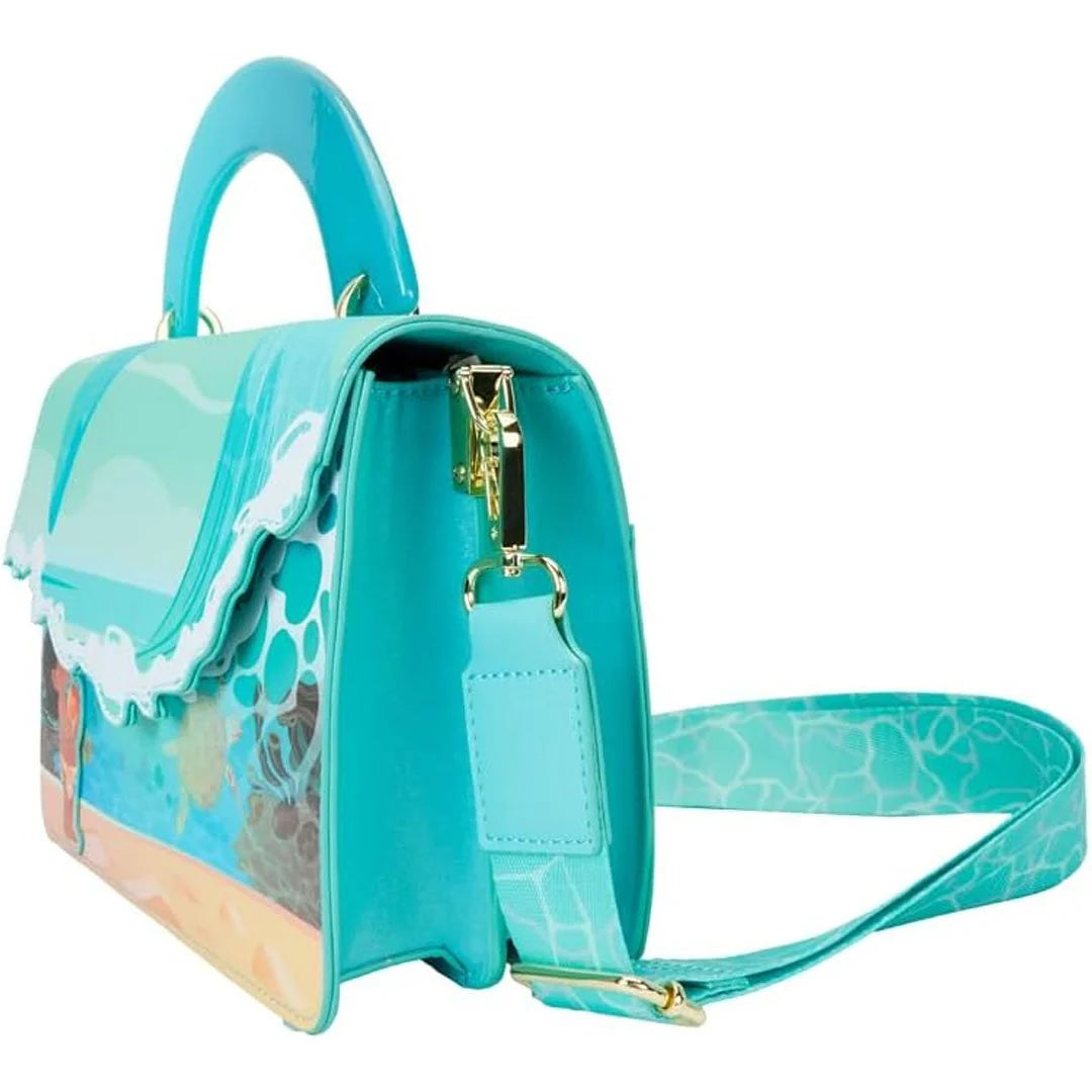 Turquoise handbag with a dolphin design on a white background