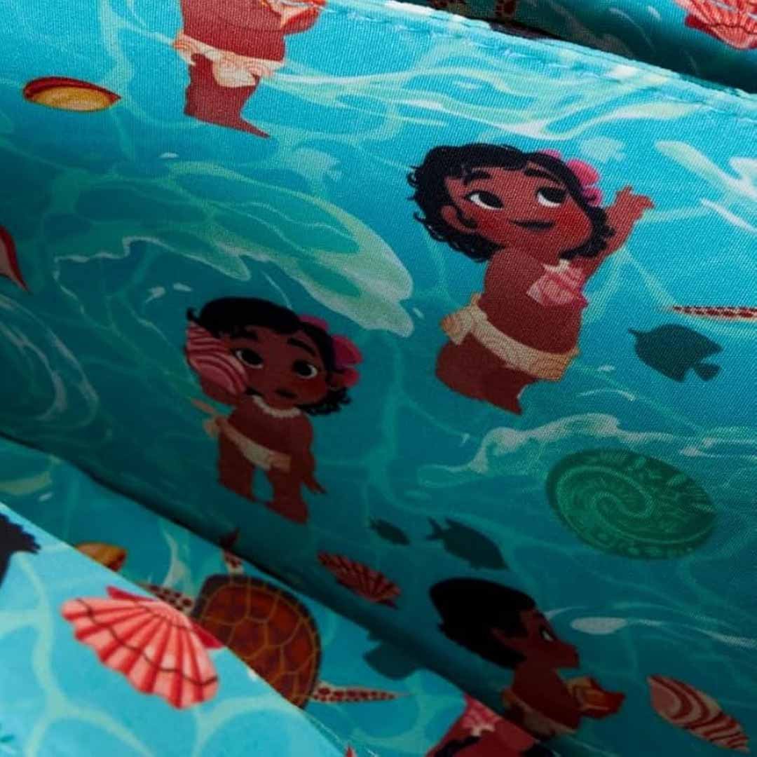 Fabric with baby Moana design on a blue background