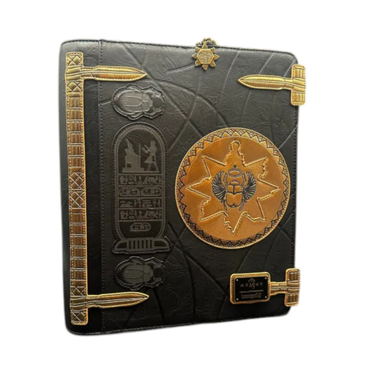 Decorative black and gold book with Egyptian-themed embossing on a white background