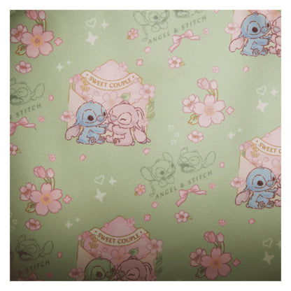 Inside Front Stitch & Angel Cherry Blossom Bow Handle Crossbody Bag with strap and floral design on a white background Patterned with stitch and angel characters and floral designs on a green background