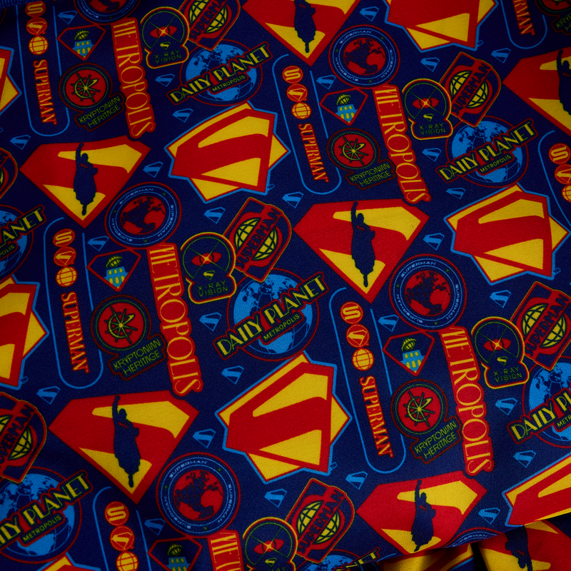 Inside lining with blue , red, and yellow Superman-themed designs. 