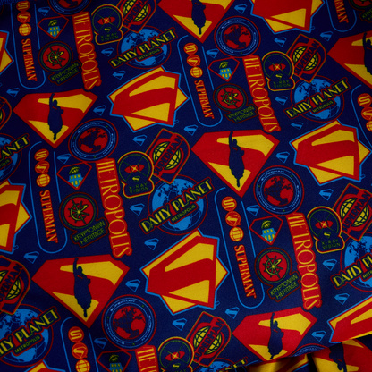 Inside lining with blue , red, and yellow Superman-themed designs. 