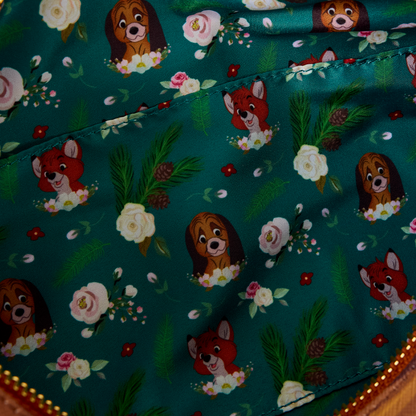 Inside view of The Fox and the Hound Forest Floral Log Figural Crossbody fabric with fox and hound pattern on a teal background