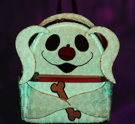 Front Zero Sequin Cosplay Glow Mini Backpack with a smiling face and bone emblem glowing on a dark background