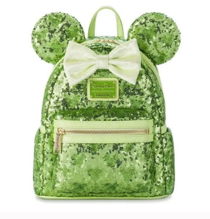 Green sequin backpack with mouse ears and a bow on a white 