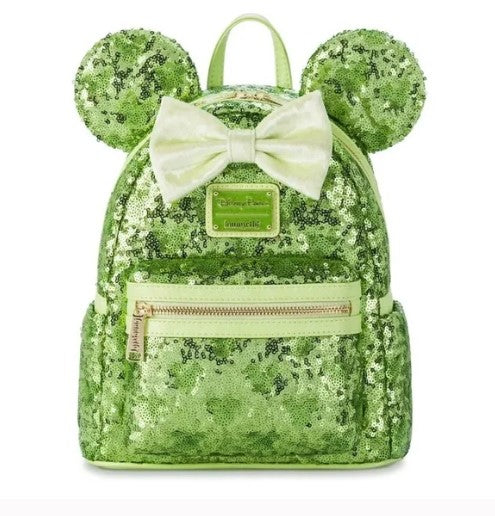 Green sequin backpack with mouse ears and a bow on a white 