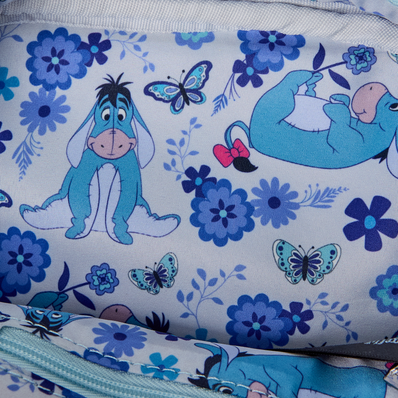 Inside view of Crossbody Bag with Fabric with Eeyore and flowers on a light blue background