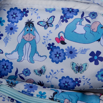 Inside view of Crossbody Bag with Fabric with Eeyore and flowers on a light blue background