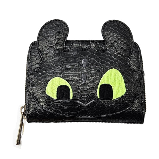 Black dragon-shaped Toothless wallet with green eyes, fom How to Train Your Dragon on a white background