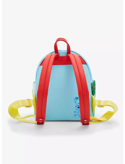 Back view of Blue's Clues House backpack with red straps and a picture of Blue on a white background