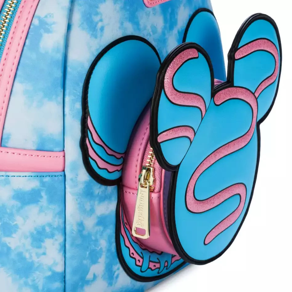 Blue and pink MIckey Mouse-shaped macaron pouch with a gold zipper on a blue and pink cloud-patterned background