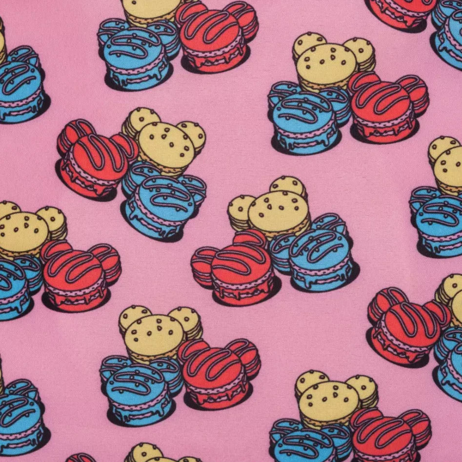Colorful macaron pattern on a pink background