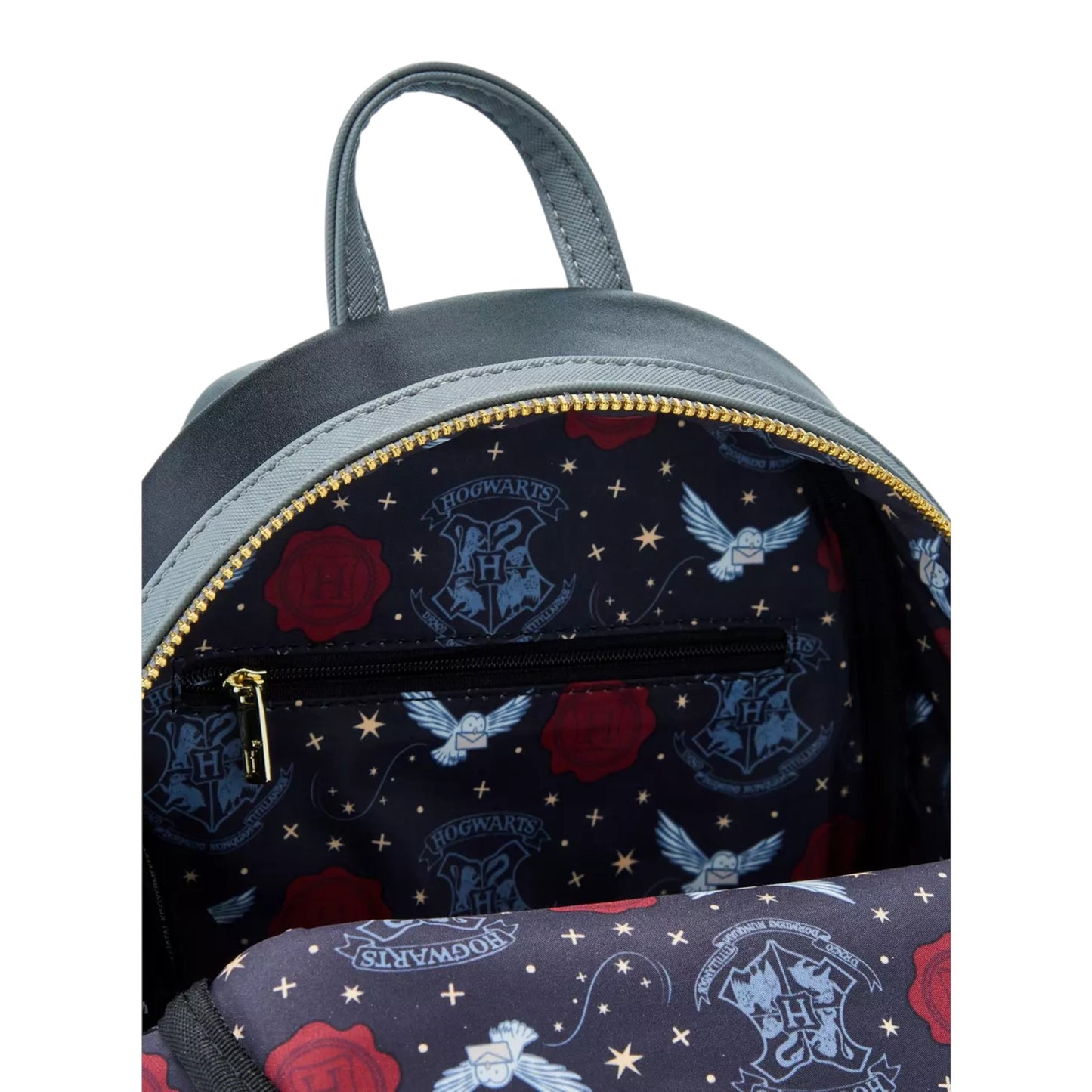 Inside Harry Potter Hogwarts Letter Mini Backpack with Harry Potter-themed design featuring Hogwarts crest and characters on a white background