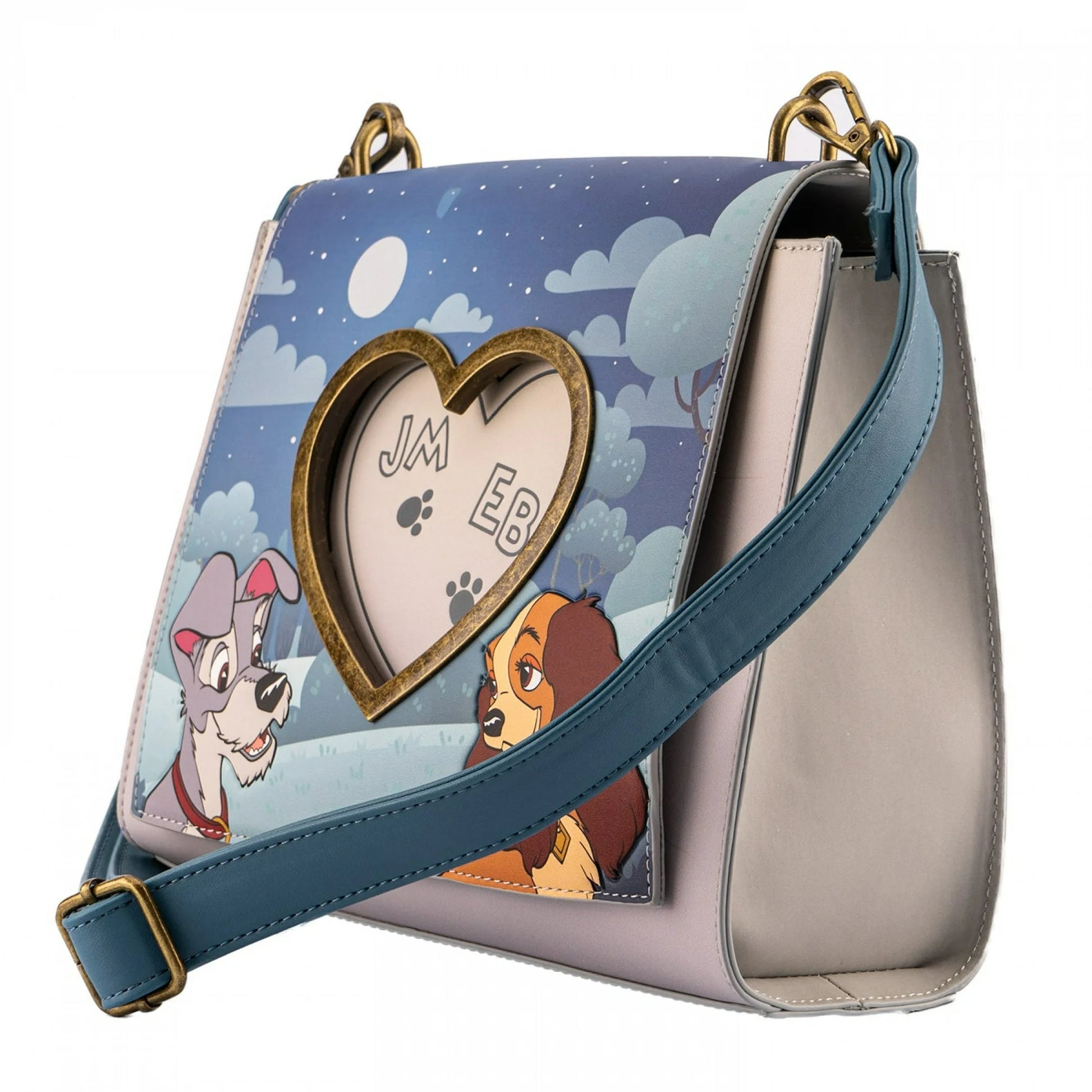 Handbag with Lady and the Tramp  and a heart-shaped cutout on a blue and white background