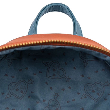 Close-up of a blue bag with gold zipper and heart pattern interior.