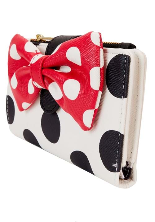 Wallet with red polka dot bow and black and white polka dot pattern on a white background