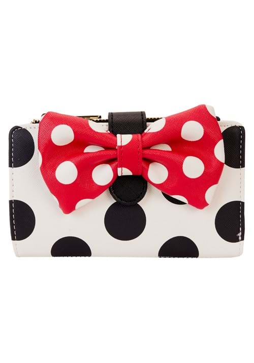 Polka dot wallet with a red bow on a white background
