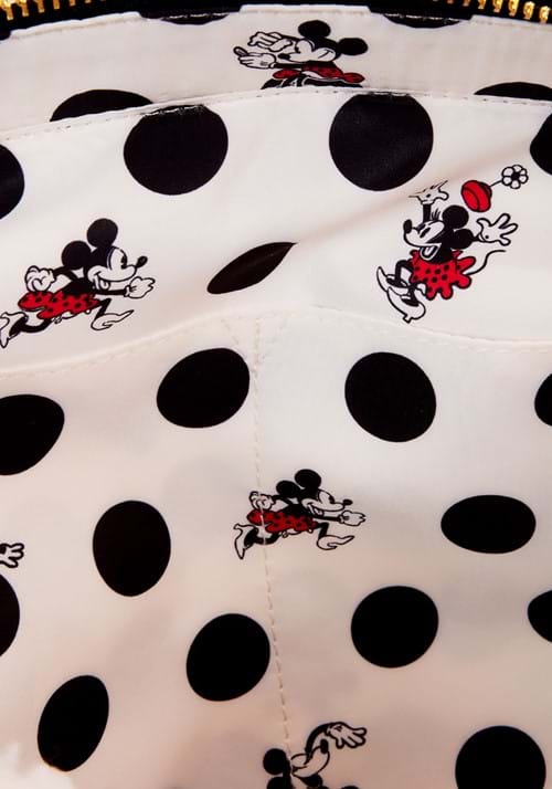 Close-up of a polka dot fabric with Minnie Mouse designs on a white background