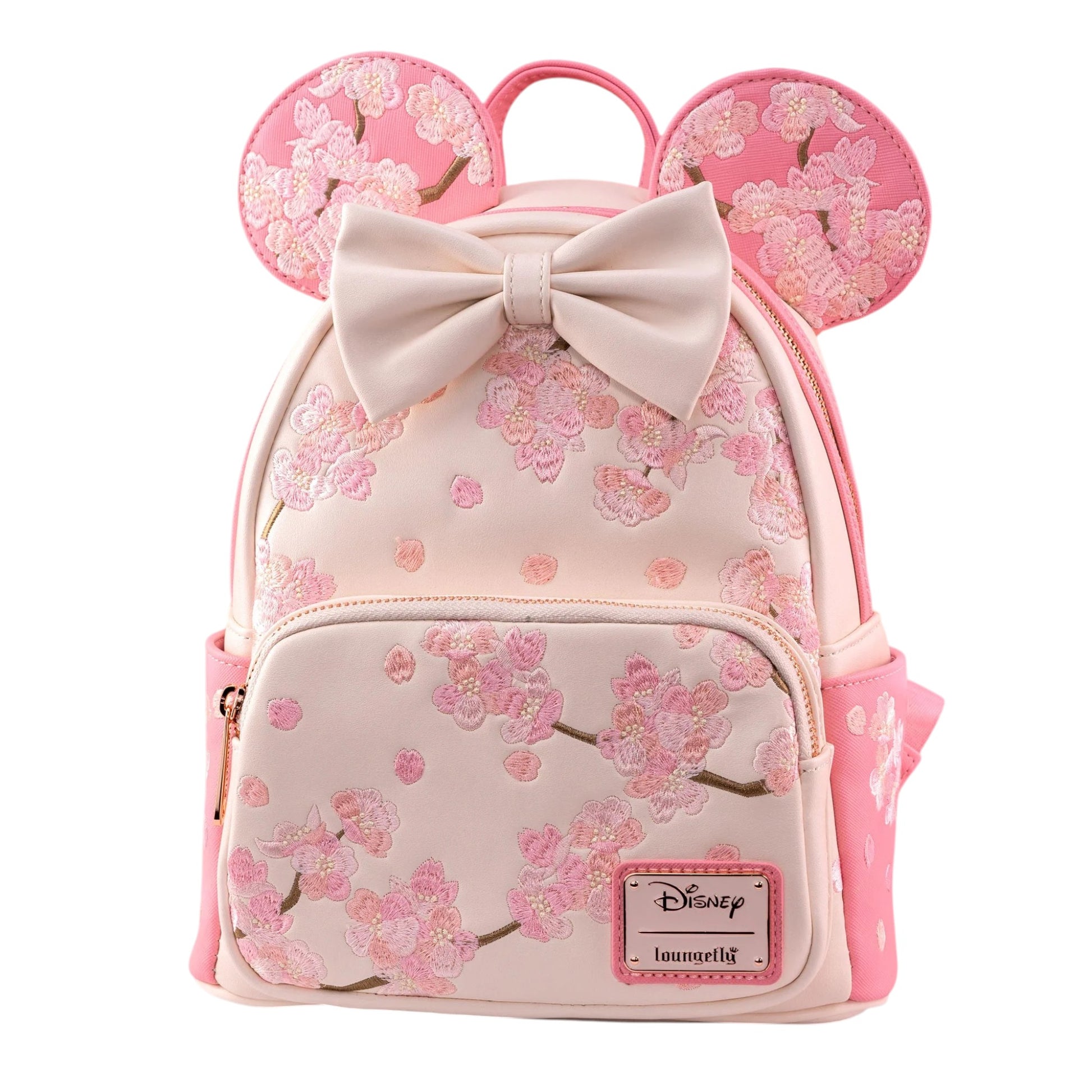Pink Minnie Mouse backpack with cherry blossom design and bow, featuring a Disney logo.