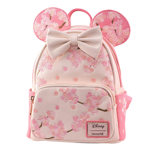 Pink Minnie Mouse backpack with cherry blossom design and bow, featuring a Disney logo.
