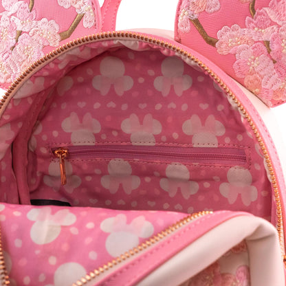 Pink backpack with Minnie Mouse design and heart pattern inside