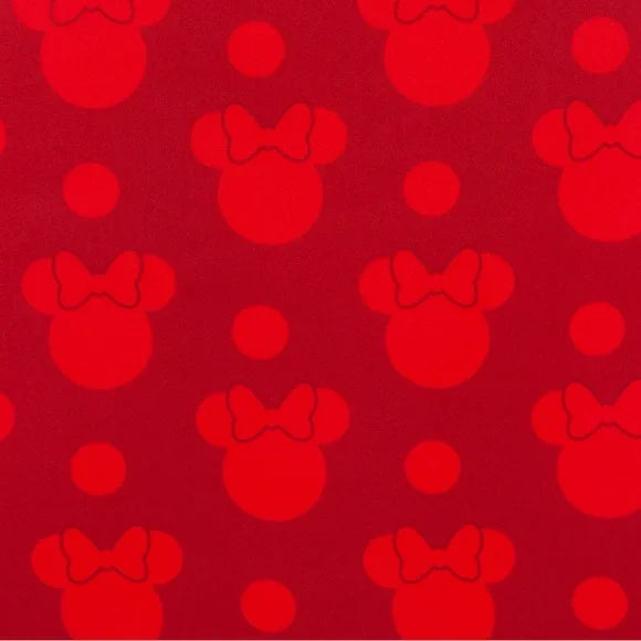 Red pattern of Minnie Mouse heads with bows on a red background