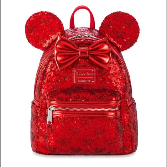 Red sequin backpack with Minnie Mouse ears and bow on a white background