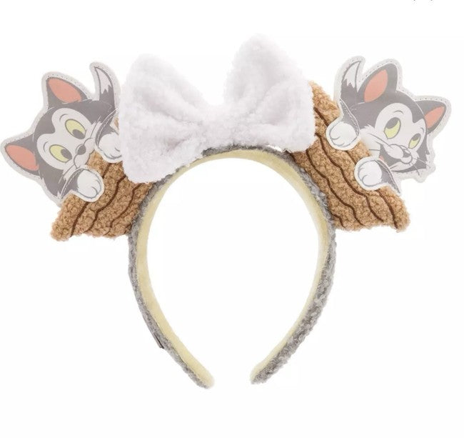 Headband with Figaro and a bow on a white background