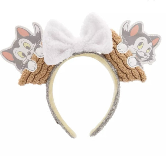 Headband with Figaro and a bow on a white background