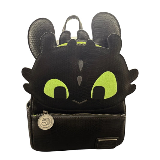Black Toothless backpack with dragon design featuring green eyes and ears on a white background